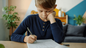 boy struggling to write